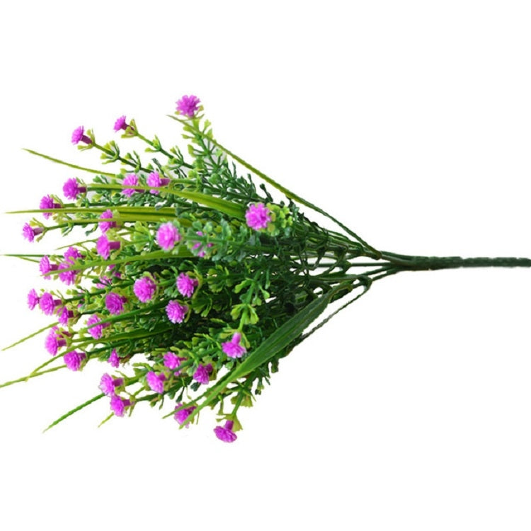 Purple artificial flower spray with small clustered blossoms and green stems