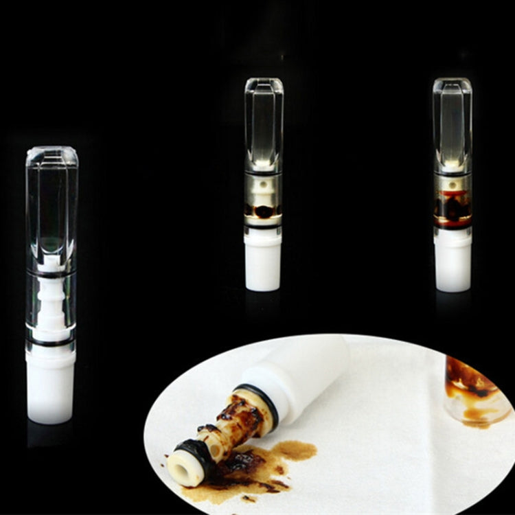 Transparent cigarette holder shown upright with clear mouthpiece tube and white filter base