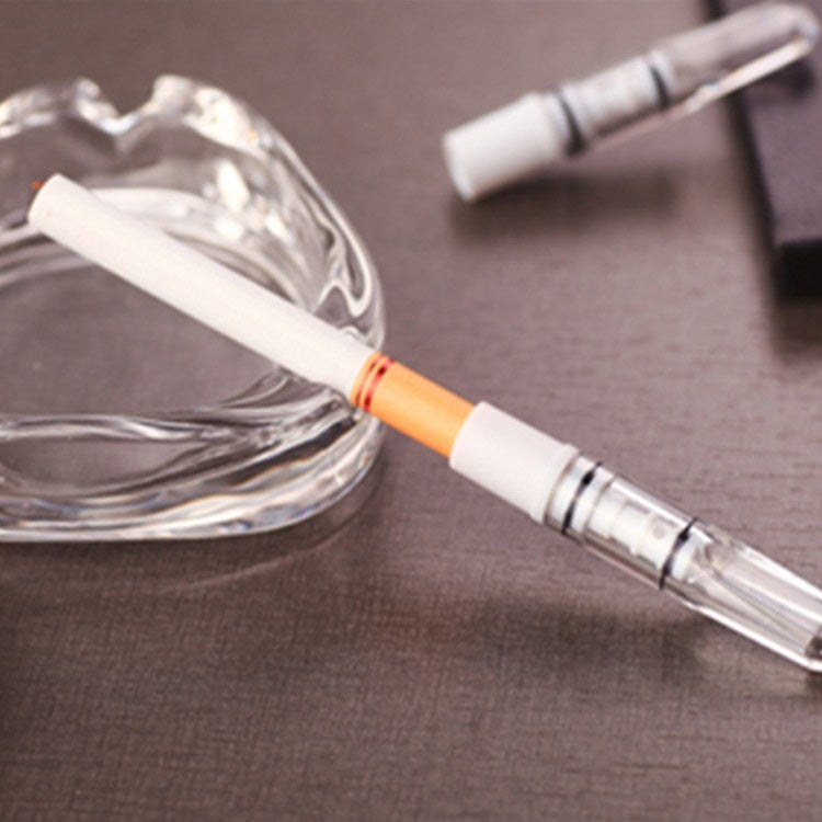 Transparent cigarette holder with white tip and visible filter cartridge