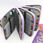 Lavender PU leather pencil case, open with colorful pencils in fold sections