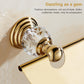 Gold toilet paper roll holder with clear crystal knob and back-mounted metal ring