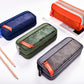 Camouflage pencil cases with double zippers in navy, green, and gray