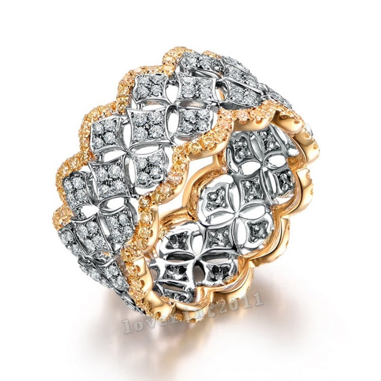 Gold and silver pavé diamond wedding ring with interwoven geometric band