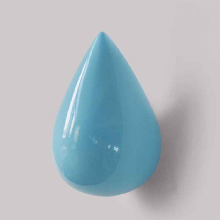 Blue resin water droplet wall hook, glossy teardrop single coat hanger close-up