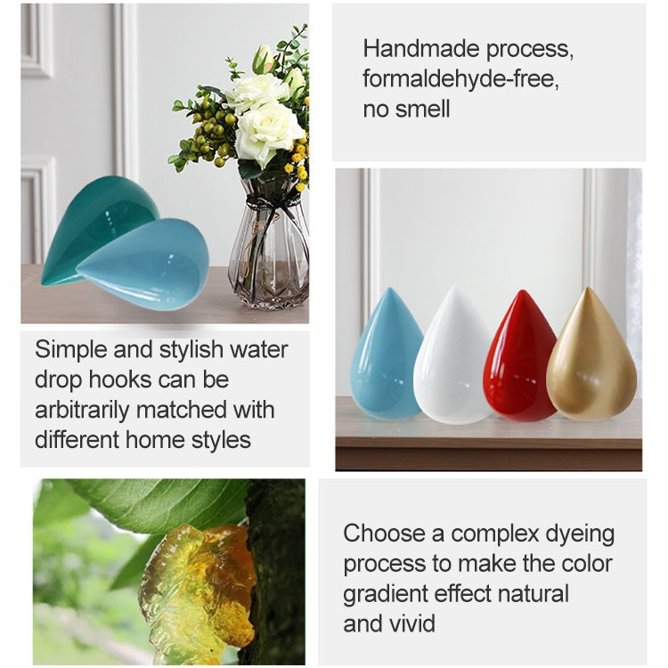 Set of resin water droplet wall hooks in blue, white, red, and gold