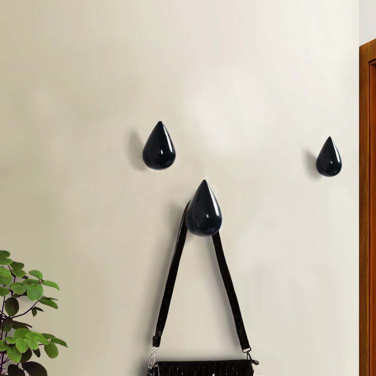 Black resin water droplet wall hooks with a pair of straps and three drop tips
