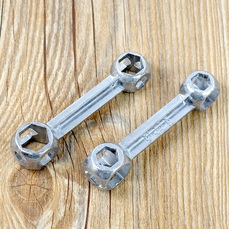 Two mini hex wrenches with round socket ends, silver metal on wood