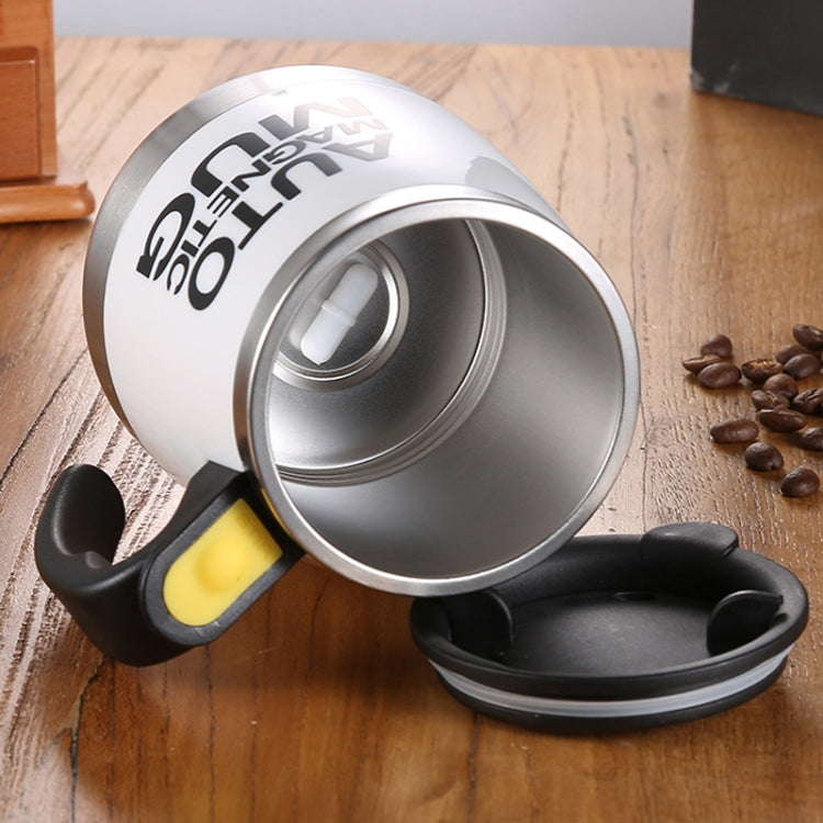 Black auto magnetic mixing mug with open lid and yellow mixer switch