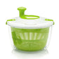 Green and white salad spinner with mesh drain basket and snap-on top lid