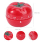 Red tomato-shaped mechanical timer with green star stem and visible dial scale