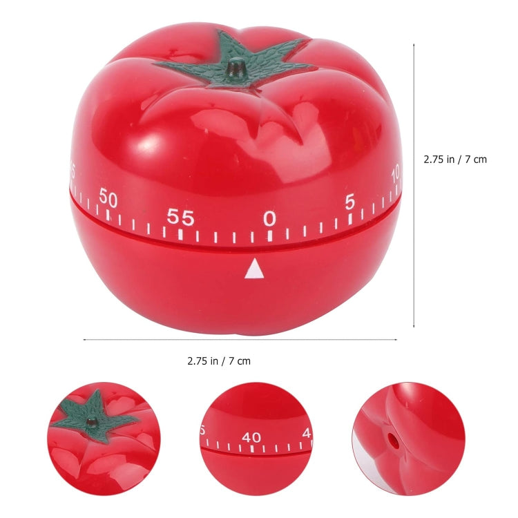 Red tomato-shaped mechanical timer with green star stem and visible dial scale