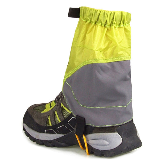 Lime green outdoor legging protective covers with elastic cuff and drawstring over boots