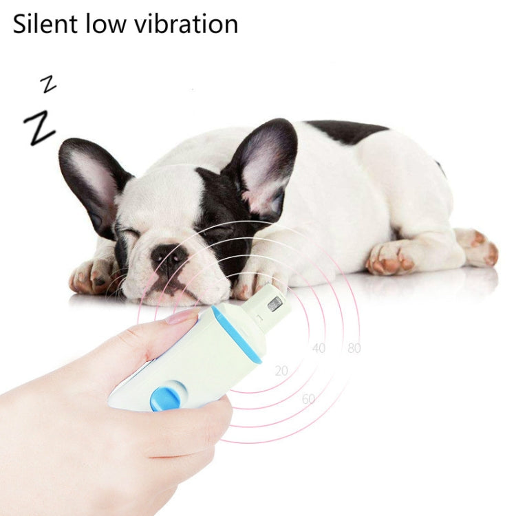 Blue-accent pet electric nail polisher held near sleeping dog for quiet vibration