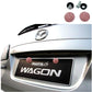 Red rhinestone screw caps installed on a car license plate panel