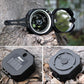 Outdoor flip compass on rock with open dial window and protective cover