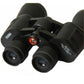 Close-up of black binoculars with textured focus ring and objective lenses