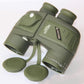 Olive 10x50 binoculars with lens caps placed nearby and short strap