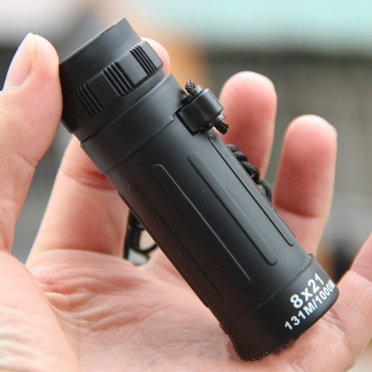 Compact monocular telescope in black, showing side grip and adjustment rings