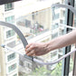 Telescopic drying rack with white wire bars and gray curved support stand