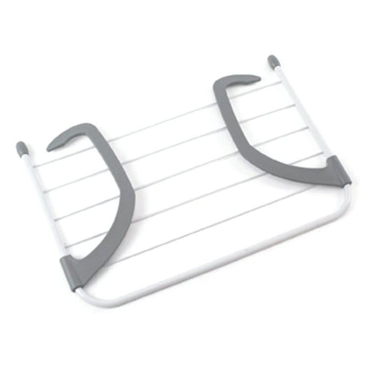 Foldable white drying rack with gray end supports and hanging bar clips