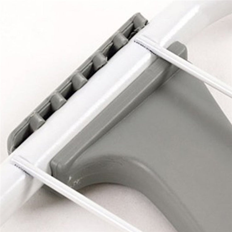 Close-up of folding joint and gray support on a white drying rack frame