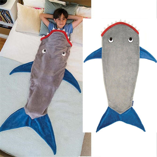 Shark-shaped sleeping blanket swaddle, grey body with blue tail fins and red dorsal fin