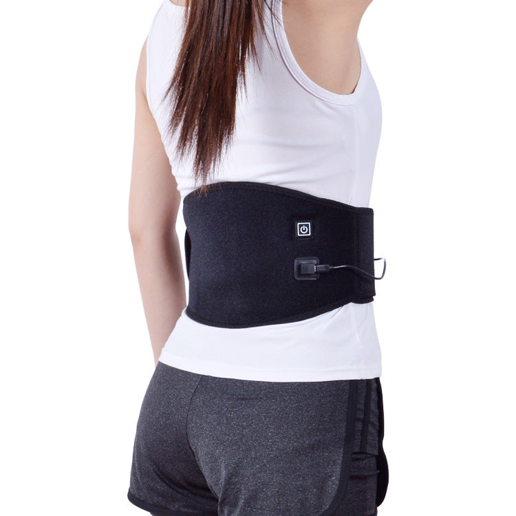 Black heating waist belt with controller patch and cord, worn over shirt