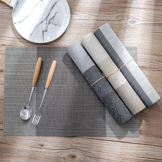 PVC non-slip table mat set with woven texture and dark gray, gray, and beige color blocks