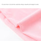 Pink ice-silk arm sleeve fabric close-up, breathable smooth knit