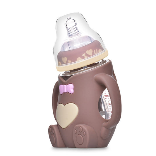 Brown baby silicone glass bottle with heart emblem, clear nipple, and side grip handles