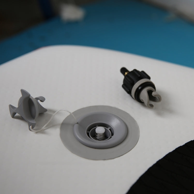 Adapter connected to gray inflatable valve on a raft, with small lever on side