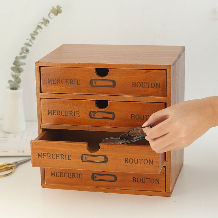 Wooden drawer storage cabinet with multiple drawers; hand pulling one drawer open.