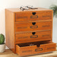 Wooden storage cabinet with four drawers and arched pulls; shoes placed on top surface.