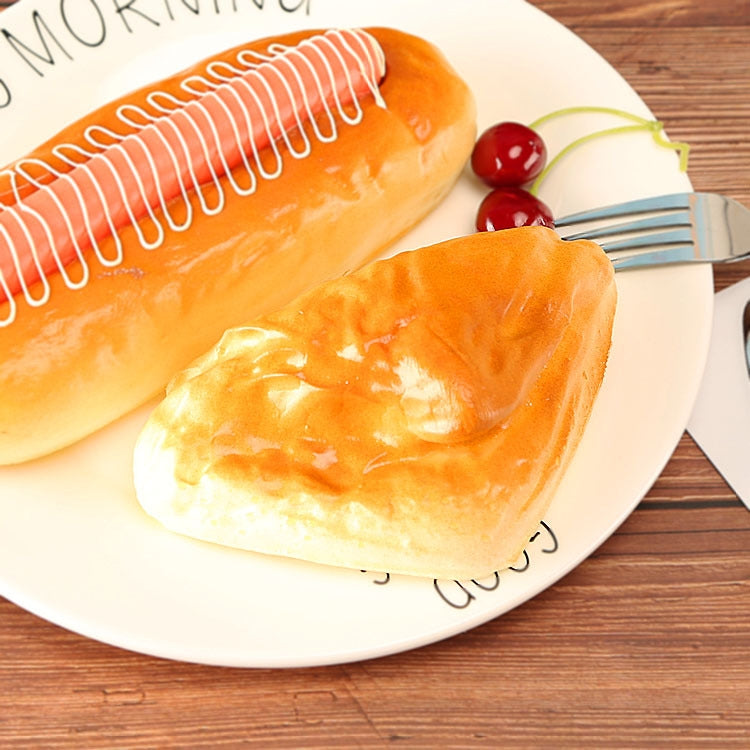 Two glossy golden-brown PU bread pieces with browned tops on a white plate