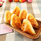 Basket of golden-brown PU bread rolls and loaf pieces, decorative prop
