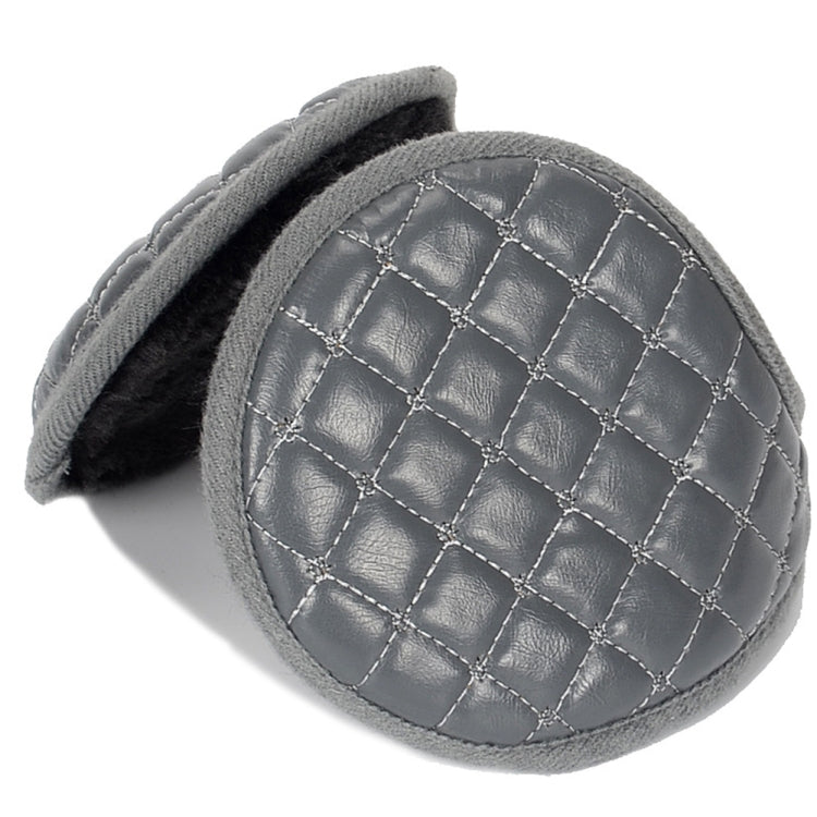 Close-up of grey quilted leather earmuff with grid stitching and fuzzy inner pad