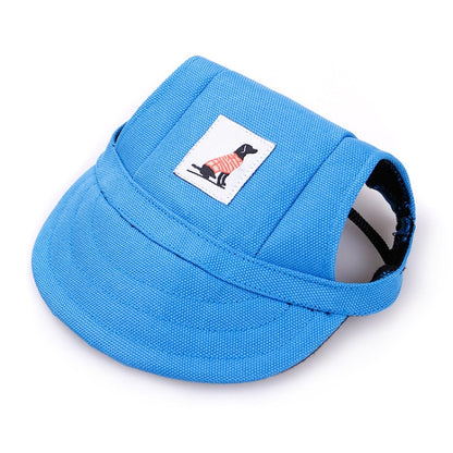 Blue adjustable baseball cap for pets with fabric logo patch and side opening