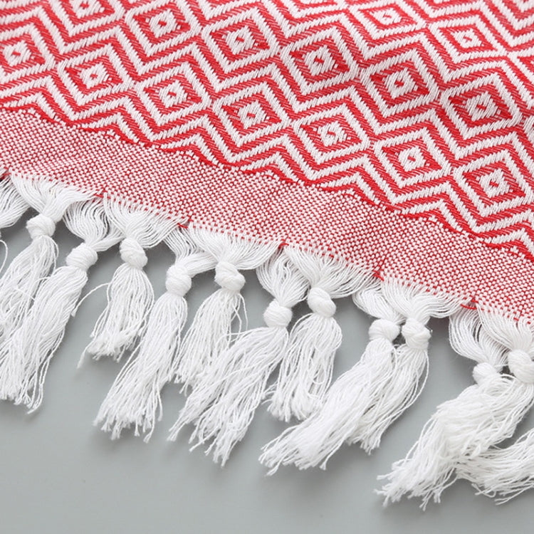Red-and-white zigzag cotton towel with long white tassel fringe at the edge