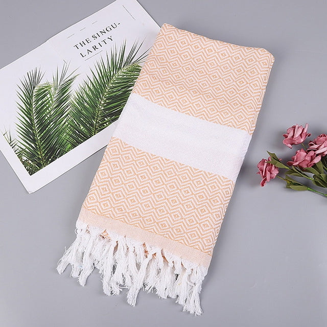 Light orange and white zigzag striped cotton bath towel with white tassel fringe