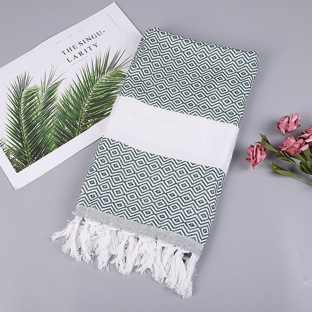 Dark teal and white zigzag striped cotton bath towel with white tassel fringe