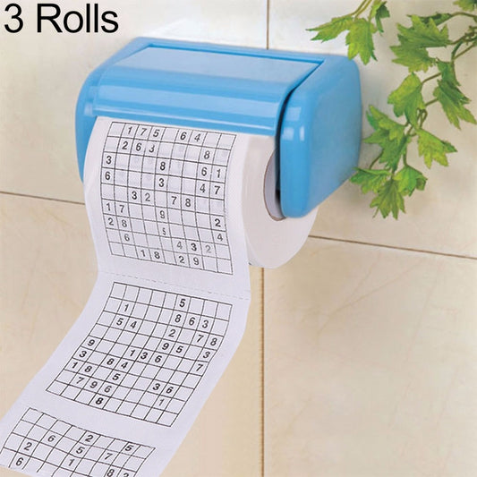 3 rolls white toilet paper with printed sudoku grids on sheet, in blue dispenser