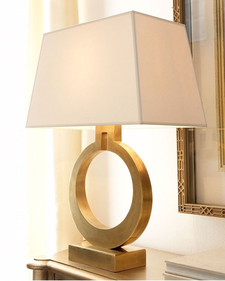 Retro bedside reading lamp with oval ring base and beige fabric shade