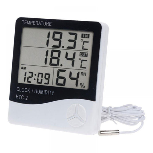 Indoor/outdoor electronic thermometer with large LCD showing in/out temperature, clock, and humidity.