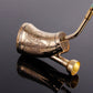Metal tobacco roller cigarette maker, ornate gold tube with flared reflective ends