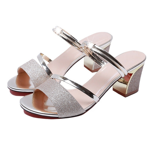 Open-toe block-heel sandals with gold glitter straps and chrome-tone T-strap, thick heel