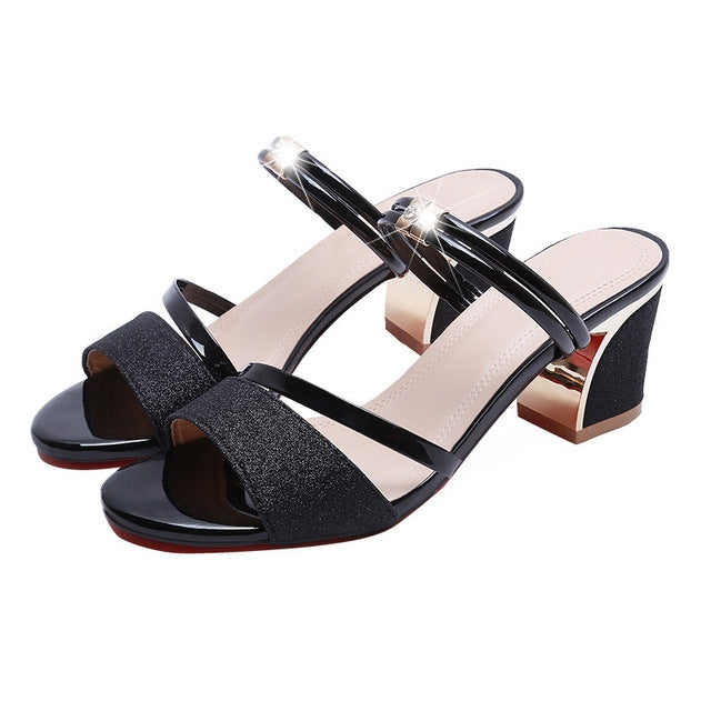 Open-toe block-heel sandals with black glitter straps and glossy black T-strap, thick heel