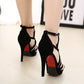 Black high-heel fish sandals with thin straps and red-studded heel
