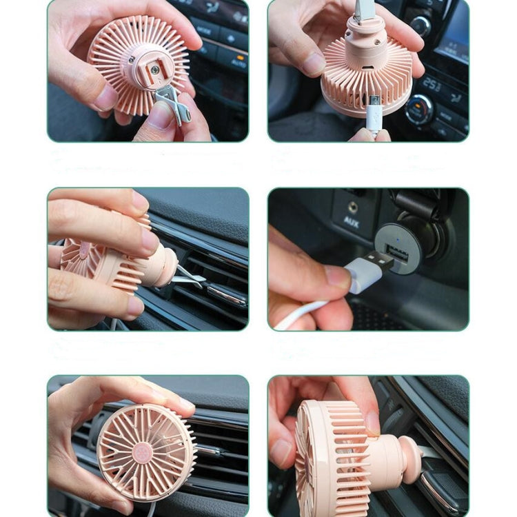 Pink mini car vent fan installed on dashboard vent, handheld adjustment