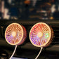 Colorful LED mini car vent fan with two glowing round grilles on dashboard