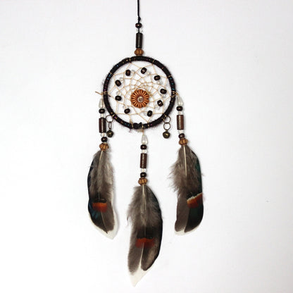 Single-ring dream catcher with beaded web and three hanging feathers, brown and red accents